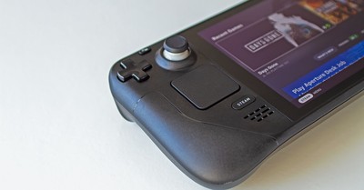 Detailed view of a handheld gaming console showcasing game selection on its screen.